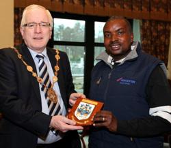 Rev Naftaly Lemooke receiving a gift from the Mayor of Lisburn Councillor Alan Ewart. 